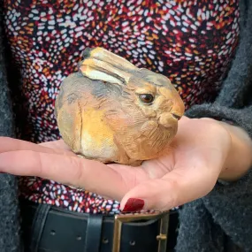 Small ceramic rabbit sculpture in brown